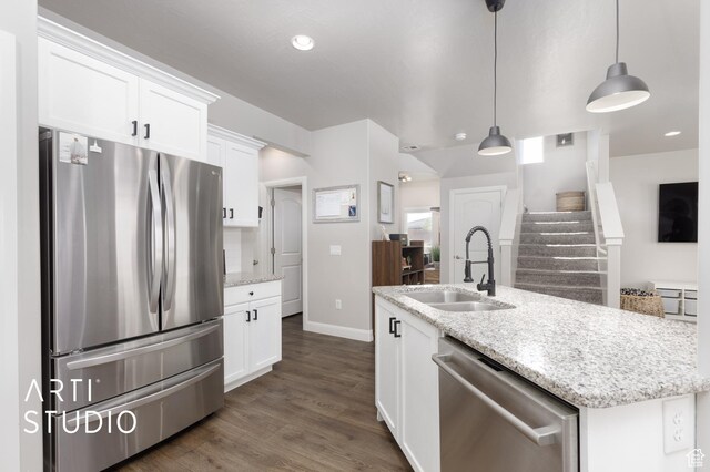 3694 E Tauri Way, St George, UT 84790 - kitchen featuring stainless steel appliances, white cabinets, dark wood-style floors, decorative light fixtures, and light stone countertops