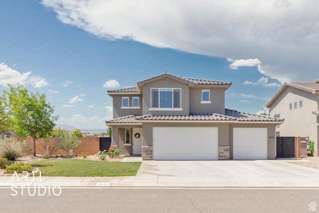 3694 E Tauri Way, St George, UT 84790 - mediterranean / spanish-style home with stucco siding, stone siding, driveway, and a tiled roof