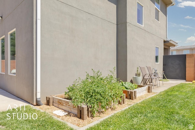 3694 E Tauri Way, St George, UT 84790 - view of home's exterior with a garden and stucco siding