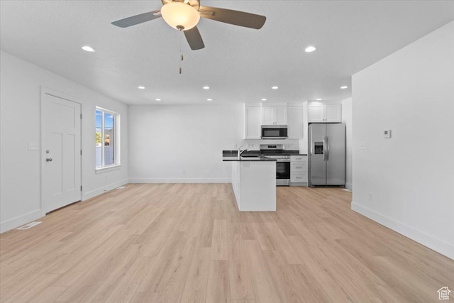 210 W 815 N Unit 24, Nephi, UT 84648 - unfurnished living room featuring recessed lighting, light wood-style floors, and a ceiling fan