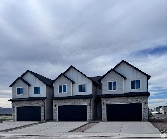 210 W 815 N Unit 24, Nephi, UT 84648 - view of front facade with a garage, stone siding, and board and batten siding