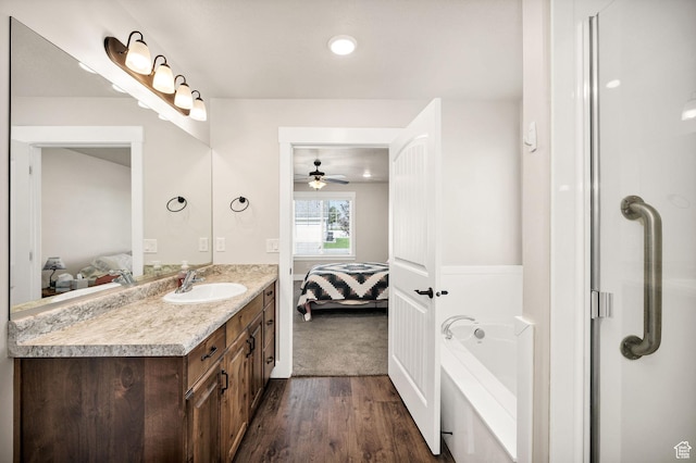 824 N 980 W, Tremonton, UT 84337 - ensuite bathroom with vanity, wood finished floors, a bath, and a ceiling fan