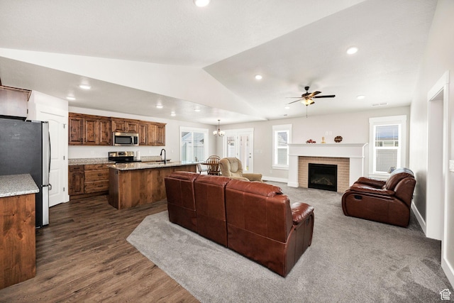 824 N 980 W, Tremonton, UT 84337 - living area featuring a ceiling fan, recessed lighting, lofted ceiling, a fireplace, and dark wood finished floors