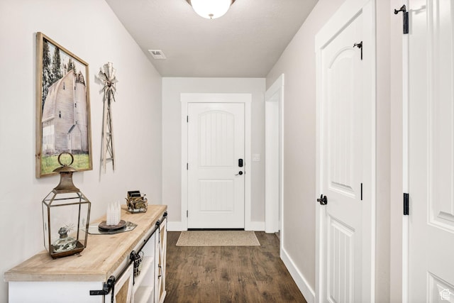 824 N 980 W, Tremonton, UT 84337 - doorway featuring dark wood-style floors and baseboards