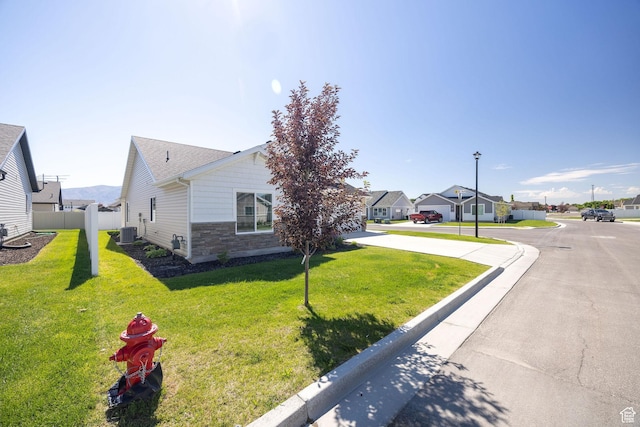 824 N 980 W, Tremonton, UT 84337 - view of side of property with stone siding and a residential view
