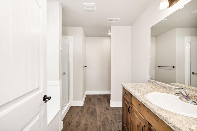 824 N 980 W, Tremonton, UT 84337 - full bath featuring wood finished floors, vanity, and a stall shower