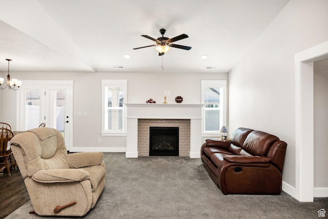 824 N 980 W, Tremonton, UT 84337 - living room with a chandelier, a ceiling fan, a fireplace, carpet, and recessed lighting