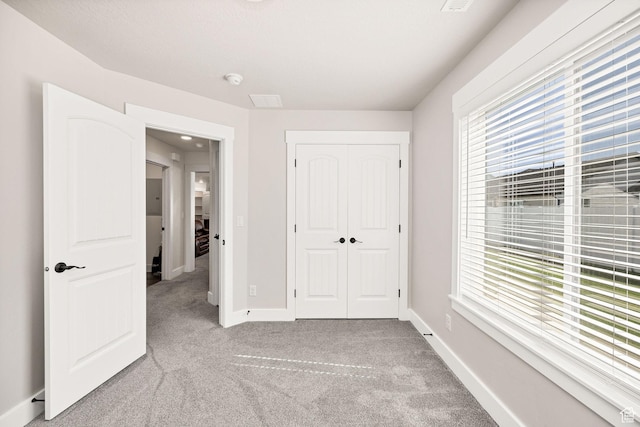 824 N 980 W, Tremonton, UT 84337 - unfurnished bedroom featuring light colored carpet and a closet