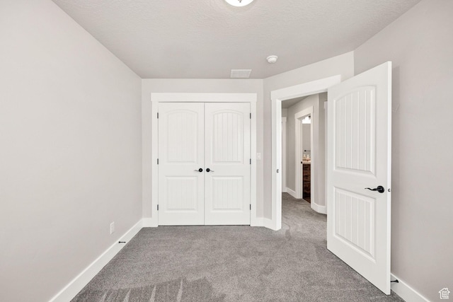 824 N 980 W, Tremonton, UT 84337 - unfurnished bedroom with carpet, a closet, and a textured ceiling