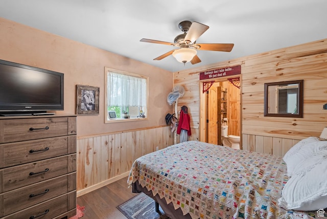 1665 E 1200 N, Mount Pleasant, UT 84647 - bedroom with wood walls, dark wood finished floors, wainscoting, and a ceiling fan