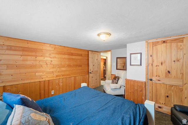 1665 E 1200 N, Mount Pleasant, UT 84647 - carpeted bedroom featuring wood walls and a textured ceiling
