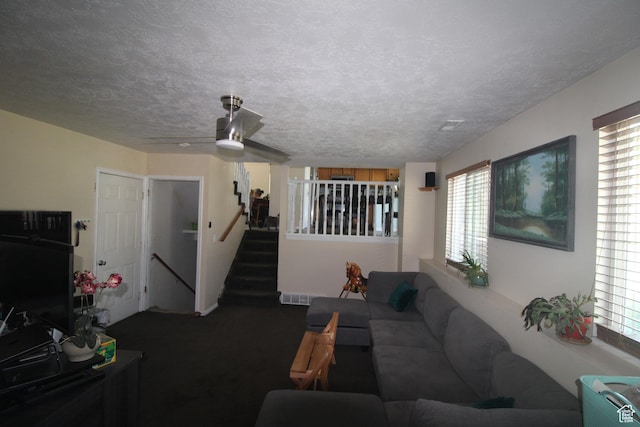 423 W 180 N, Clearfield, UT 84015 - living area with carpet, ceiling fan, a textured ceiling, and stairs