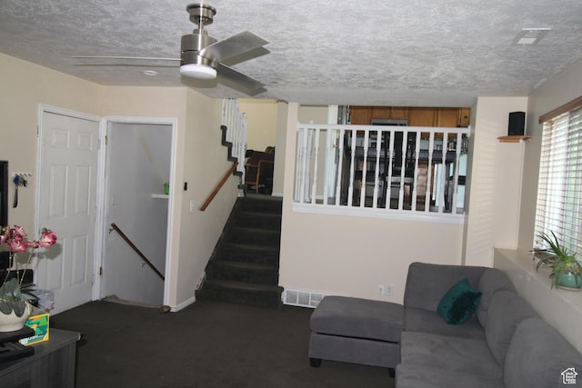 423 W 180 N, Clearfield, UT 84015 - carpeted living room with ceiling fan, a textured ceiling, and stairway