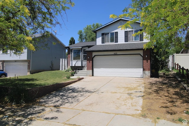 423 W 180 N, Clearfield, UT 84015 - tri-level home with an attached garage, concrete driveway, and brick siding