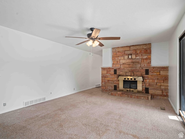 2713 N 650 E, North Ogden, UT 84414 - unfurnished living room with ceiling fan, carpet flooring, and a stone fireplace