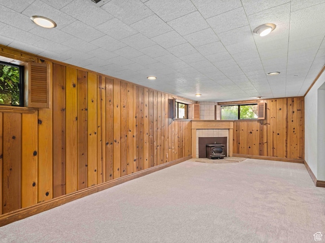 2713 N 650 E, North Ogden, UT 84414 - below grade area featuring wooden walls, carpet, and a wood stove