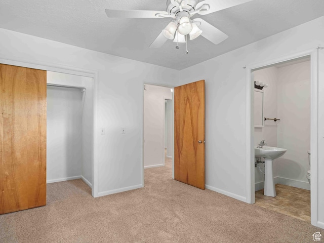 2713 N 650 E, North Ogden, UT 84414 - unfurnished bedroom with carpet, a closet, connected bathroom, and ceiling fan