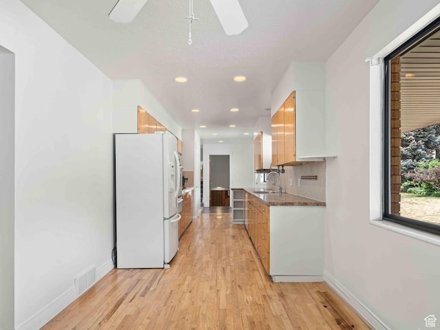 2713 N 650 E, North Ogden, UT 84414 - kitchen with white refrigerator with ice dispenser, light wood-type flooring, recessed lighting, a ceiling fan, and modern cabinets