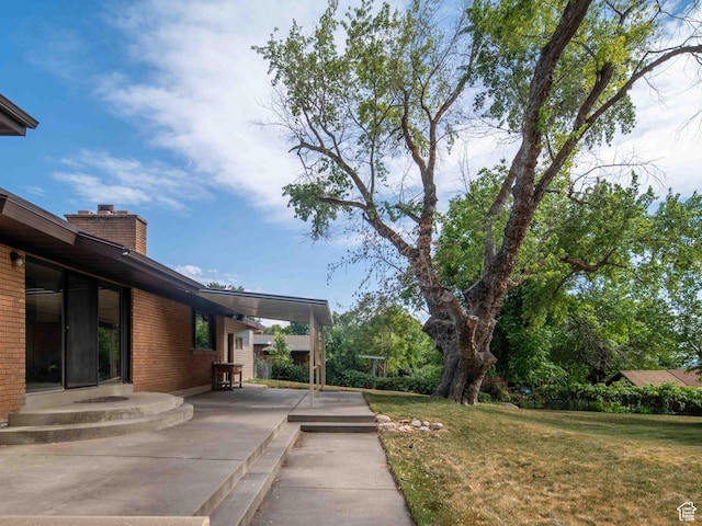 2713 N 650 E, North Ogden, UT 84414 - view of green lawn with a patio
