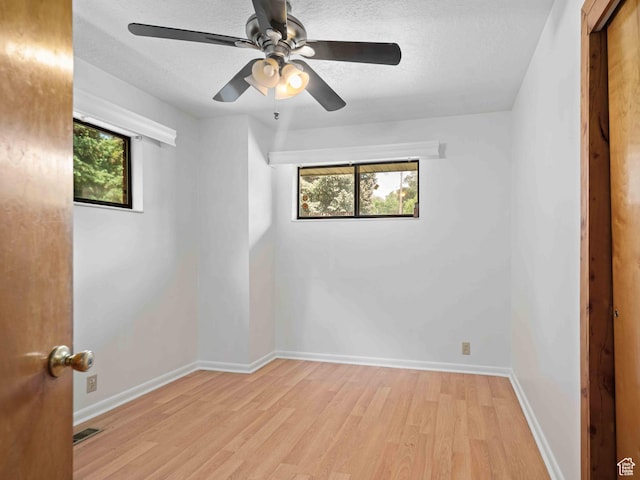 2713 N 650 E, North Ogden, UT 84414 - spare room with light wood-style floors, ceiling fan, and a textured ceiling