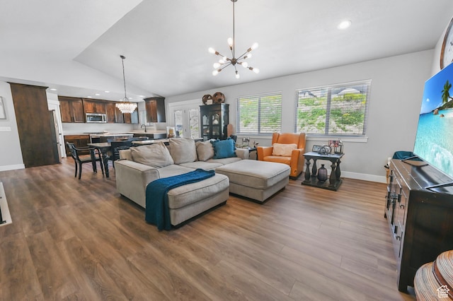 108 S 900 E, Hyde Park, UT 84318 - living area with a chandelier, vaulted ceiling, dark wood finished floors, and recessed lighting