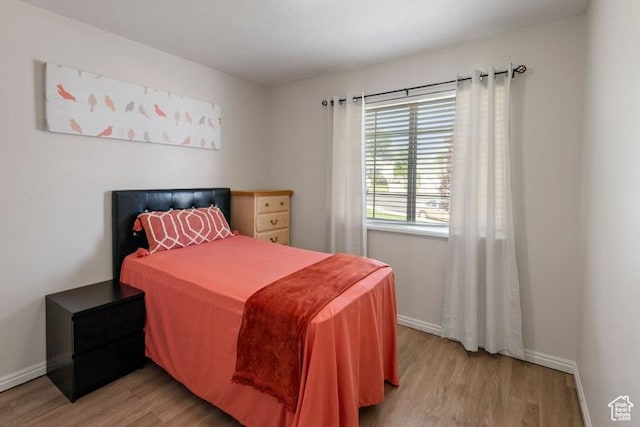 4015 S Brandon Ct, West Valley City, UT 84128 - bedroom featuring wood finished floors and baseboards