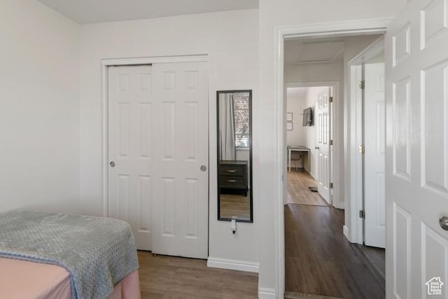 4015 S Brandon Ct, West Valley City, UT 84128 - bedroom featuring attic access, dark wood-type flooring, and a closet
