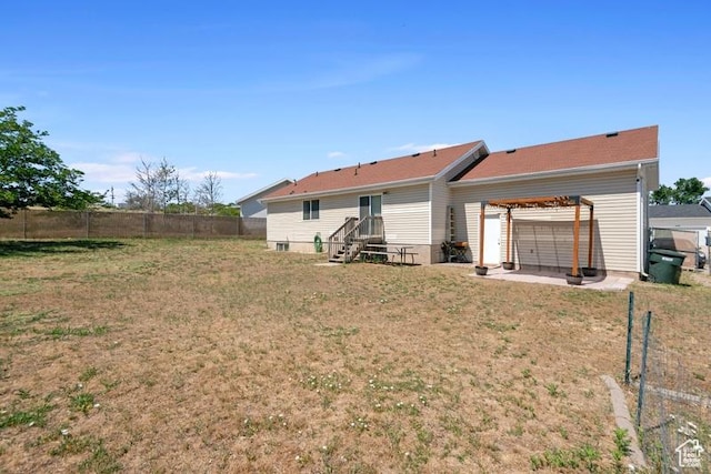 4015 S Brandon Ct, West Valley City, UT 84128 - rear view of house with a fenced backyard and a patio area