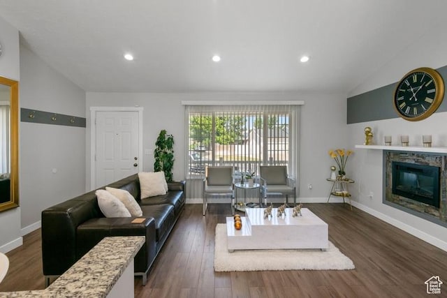 4015 S Brandon Ct, West Valley City, UT 84128 - living area featuring vaulted ceiling, dark wood finished floors, recessed lighting, and a glass covered fireplace