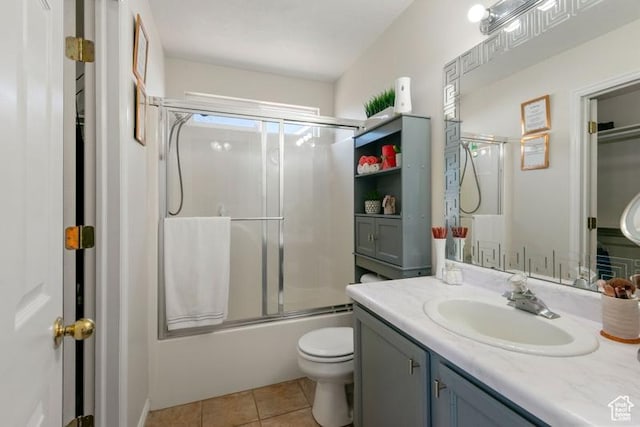 4015 S Brandon Ct, West Valley City, UT 84128 - full bathroom featuring vanity, shower / bath combination with glass door, and tile patterned flooring