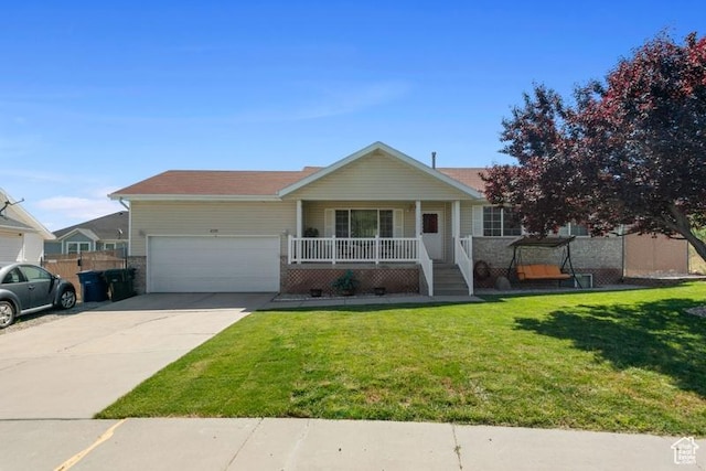4015 S Brandon Ct, West Valley City, UT 84128 - single story home with a porch, concrete driveway, an attached garage, and a front lawn