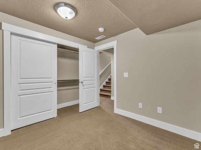 4956 W Vermillion Dr, South Jordan, UT 84009 - unfurnished bedroom with light carpet, a closet, and a textured ceiling