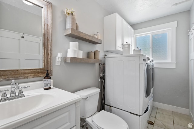 211 S 860 E, Orem, UT 84097 - bathroom featuring washer / dryer, vanity, and tile patterned flooring