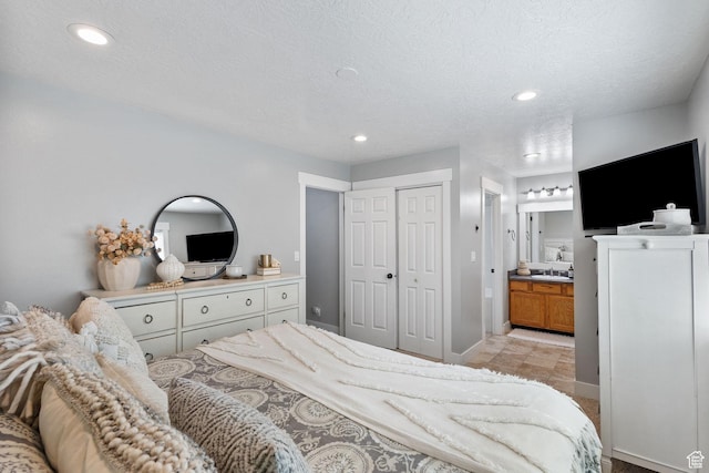 211 S 860 E, Orem, UT 84097 - bedroom with ensuite bath, a closet, recessed lighting, and a textured ceiling