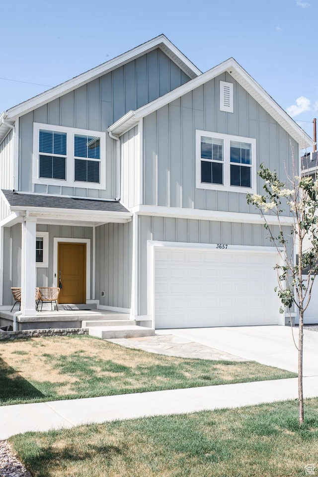 3657 E 1500 S, Spanish Fork, UT 84660 - view of front facade with board and batten siding, an attached garage, covered porch, and concrete driveway