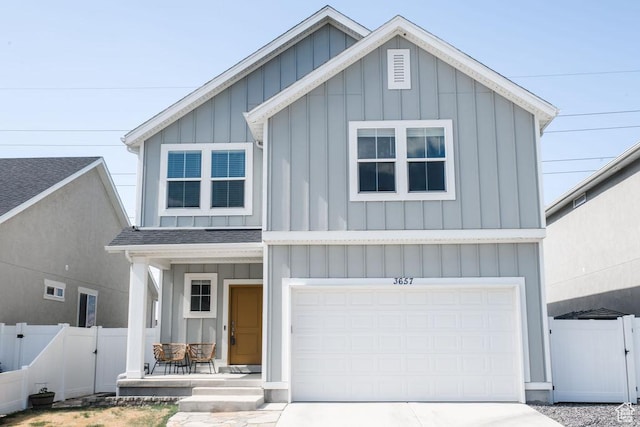 3657 E 1500 S, Spanish Fork, UT 84660 - view of front of home with board and batten siding, a gate, an attached garage, and driveway