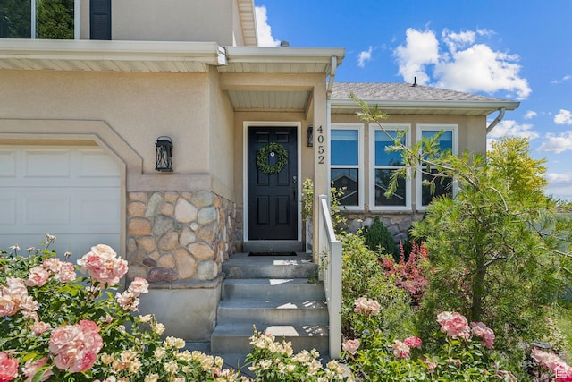 4052 W Newland Loop, Lehi, UT 84043 - doorway to property featuring stone siding, stucco siding, and an attached garage