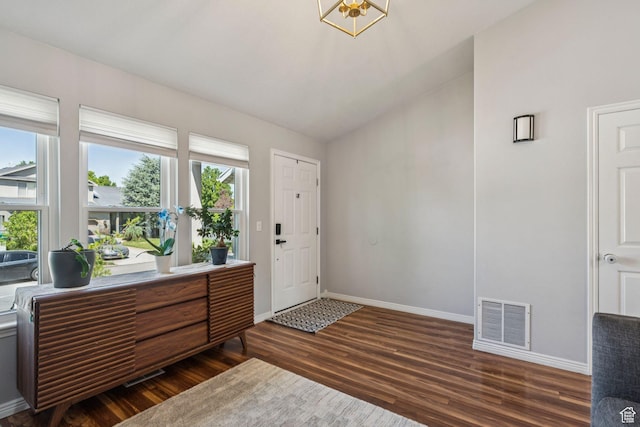 4052 W Newland Loop, Lehi, UT 84043 - entryway with dark wood-type flooring, lofted ceiling, and a chandelier