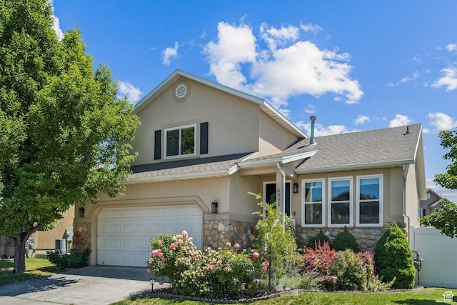 4052 W Newland Loop, Lehi, UT 84043 - traditional home featuring stone siding, stucco siding, concrete driveway, an attached garage, and roof with shingles