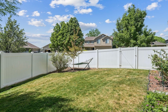 4052 W Newland Loop, Lehi, UT 84043 - fenced backyard with a gate and a residential view