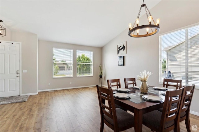 4124 S 3475 W, West Haven, UT 84401 - dining space with a chandelier, vaulted ceiling, and light wood finished floors