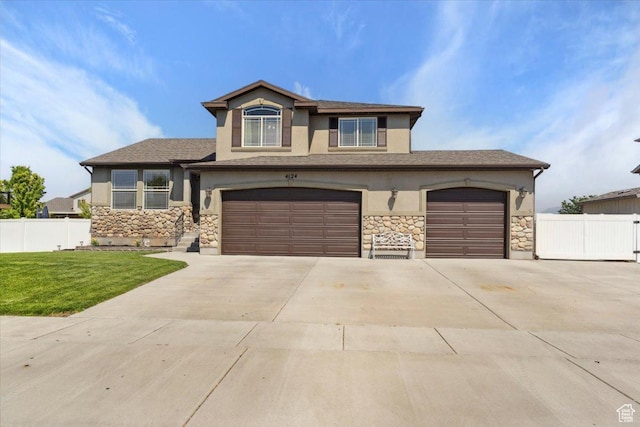 4124 S 3475 W, West Haven, UT 84401 - view of front facade featuring stucco siding, stone siding, concrete driveway, and a garage