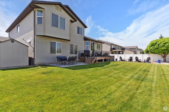 4124 S 3475 W, West Haven, UT 84401 - back of property with a patio, a storage unit, and a wooden deck
