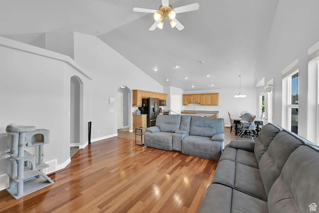 4317 S 3350 W, West Haven, UT 84401 - living area with a ceiling fan, high vaulted ceiling, arched walkways, light wood-type flooring, and recessed lighting