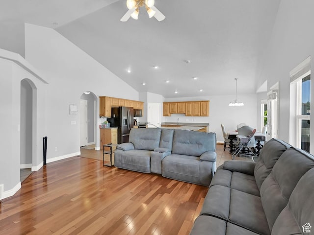 4317 S 3350 W, West Haven, UT 84401 - living room featuring ceiling fan, arched walkways, light wood finished floors, a chandelier, and recessed lighting