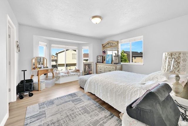 4317 S 3350 W, West Haven, UT 84401 - bedroom featuring wood finished floors and a textured ceiling