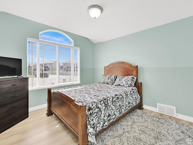 4317 S 3350 W, West Haven, UT 84401 - bedroom with multiple windows, light wood-style flooring, and vaulted ceiling