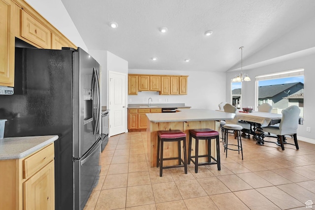 4317 S 3350 W, West Haven, UT 84401 - kitchen with stainless steel fridge, light countertops, stove, a kitchen island, and lofted ceiling