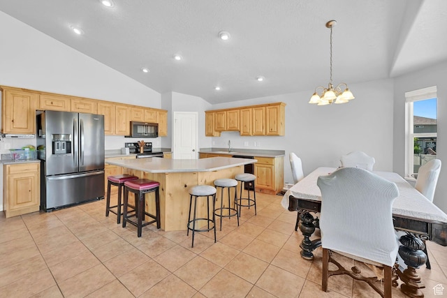 4317 S 3350 W, West Haven, UT 84401 - kitchen featuring stainless steel appliances, light countertops, a center island, a chandelier, and lofted ceiling