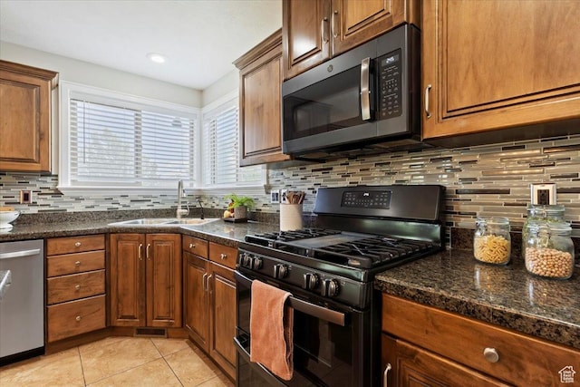 14257 S Round Rock Dr W, Herriman, UT 84096 - kitchen featuring gas stove, dishwasher, light tile patterned floors, backsplash, and brown cabinetry